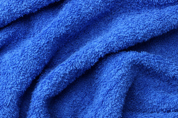 Fototapeta premium Blue beach towel texture. Blue beach towel background. Top view.