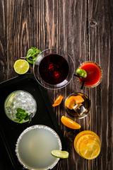 Fototapeta na wymiar Selection of classic cocktails - cosmopolitan, mojito, bloody mary, old fashioned, margarita, aperol