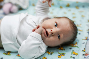 the baby is lying on the changing table