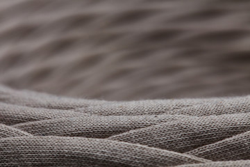 Skein of gray knitted yarn close-up. macro photography background texture pattern weave fiber textile fabric