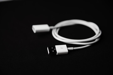 Mobile smartphone usb charger on dark background
