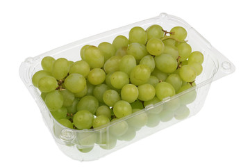 Green  sweet grapes berries  in a clear plastic container isolated macro