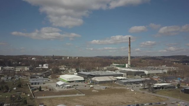 Gorlice, Poland - 3 9 2019: Industrial region of the Carpathian city. Top view of the refinery and auxiliary buildings. Video shot by drone or quadrocopter. Vanity of the day at the factory. Planning 