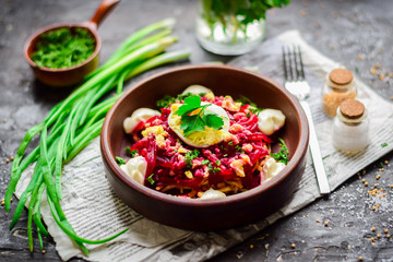 Beet salad with egg and mayonnaise.