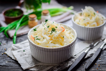 Sauerkraut with carrots and green onions.