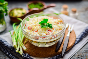 Salad with crab sticks, canned corn and fresh cucumbers. © Alena