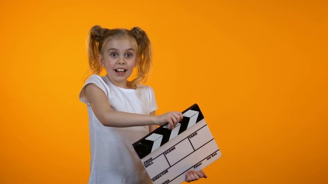 Funny girl clapping flapper pretending to be film producer, future career, dream
