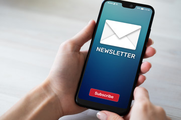 Newsletter subscription button on mobile phone screen. Business marketing concept.