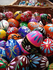 Fototapeta na wymiar Colorful traditionally decorated Easter eggs in basket, close up