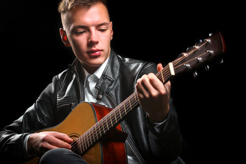 Young men playing the guitar