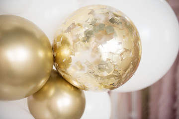 Abstract defocused blur background. Golden balloons background. Children party background. Holiday spirit.  