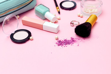 Obraz na płótnie Canvas Eye shadow and feminine accessories on pink background. Beauty