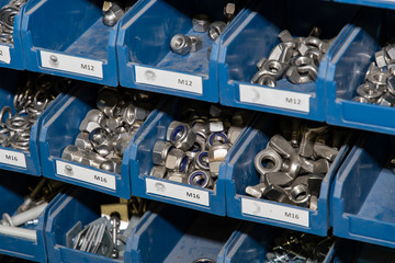Rack with stainless steel material in plastic blue boxes.
