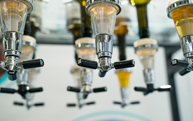 liqueur taps in a bar for spilling drinks