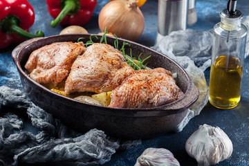 Chicken thighs and potatoes ready for baking