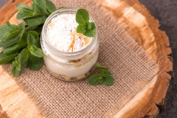 Obraz na płótnie Canvas Coconut bisquit dessert with ricotta, mint. Yogurt breakfast