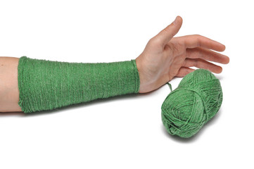 Man's hand and  green yarn isolated on a white background.Crochet.