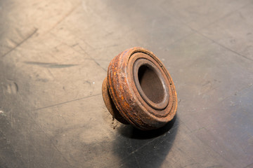 Rusty bearing with cover.