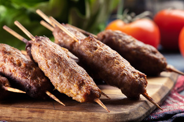 Grilled balkan cevapcici or  kebab on skewers