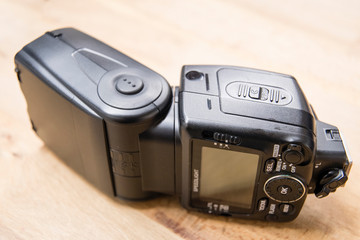 External black flash lying on the table.