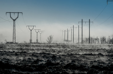 wind power turbines at sunset
