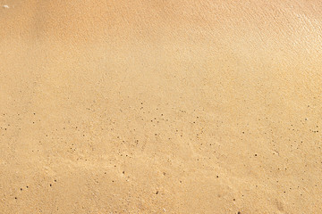 Fototapeta na wymiar Empty sand background, natural brown sand texture background