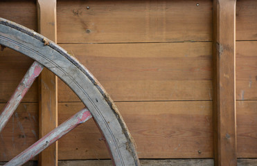 Fototapeta na wymiar Fondo de carro de madera con rueda 