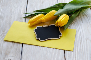 Beautiful Tulips flower on a wooden background. - Image