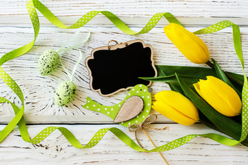 Beautiful Tulips flower on a wooden background. - Image