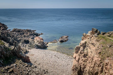 Cove with rocky beach with blue horizon Kullaberg Sweden