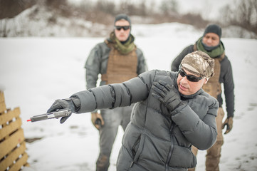 Naklejka premium Instructor demonstrate action combat tactical gun shooting to his students