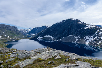 Fototapeta na wymiar Dark blue lake in the mountains of Norway