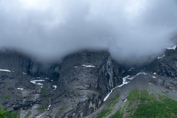 The famous Troll wall in Norway, in heavy fog and clouds