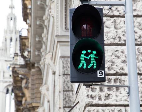 Gay couple pictured at a traffic light in Vienna.