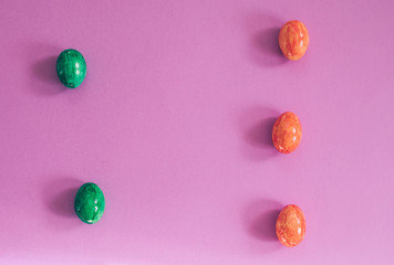 Easter eggs on violet background.