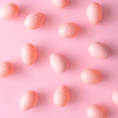 Pink Easter eggs on pink table. Minimal Easter background composition. Flat lay.