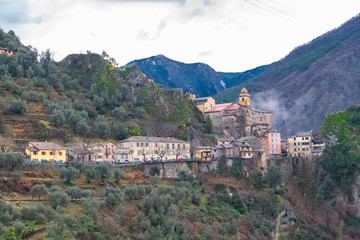 Fototapeta na wymiar Saorge, beautiful french village on the mountain, panorama with the church and colorful houses