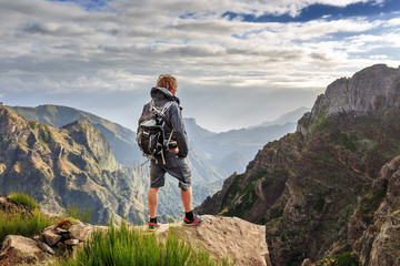 Young handsome tourist in the mountains of Madeira at Pico do Areeiro (Arieiro), while hiking to...