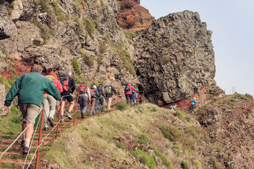 Group of senior tourists hiking in the mountains of Madeira from Pico do Areeiro (Arieiro) to Pico...