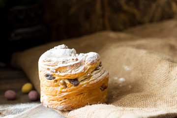 Easter sweet bread Orthodox kulich, paska, willow twigs. Easter Colorful eggs on wooden background. Easter. Holidays breakfast. Easter Palm Sunday. Space for text.