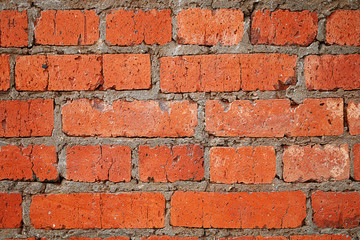 Texture of stones and cobblestones. Very old, crumbling brick wall