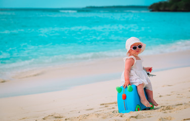 cute little girl travel on summer beach