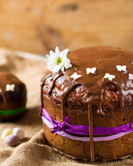 Easter sweet bread Orthodox kulich, paska, willow twigs. Easter Colorful eggs on wooden background. Easter. Holidays breakfast. Easter Palm Sunday. Space for text.