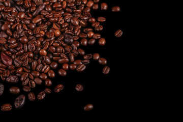 Roasted beans. Cocoa beans and coffee beans isolated on black background.