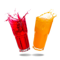 Couple orange juice and red soda splashing out of glass isolated on white background.