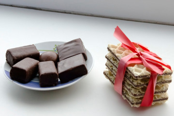 cookies tied with red ribbon and chocolate candy