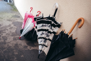 Several umbrella against a wall