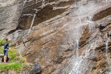 Boy at the waterfall