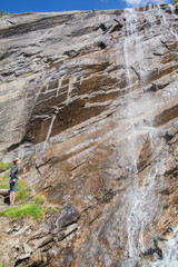 Boy at the waterfall