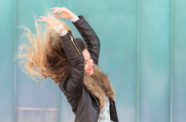 Beautiful young woman play her hair